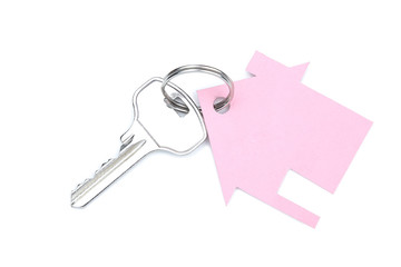 Silver key with paper house isolated on white background