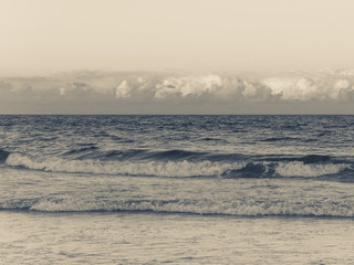 Ocean waves and clouds at sunset in Palm Beach Florida