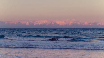 Ocean waves and clouds at sunset in Palm Beach Florida