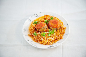 Stuffed tomatoes and rice with tomato
