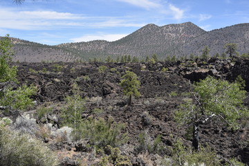 Flagstaff, AZ., U.S.A. June 5, 2018. Sunset Crater Volcano National Monument est. in 1930. Sunset Crater Volcano is a prime example of an 1,120-foot cinder volcano with substantial lava flows. 