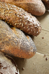 Tasty, crunchy bread on the kitchen wooden table