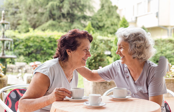 Senior Women Drinking Coffee And Talking