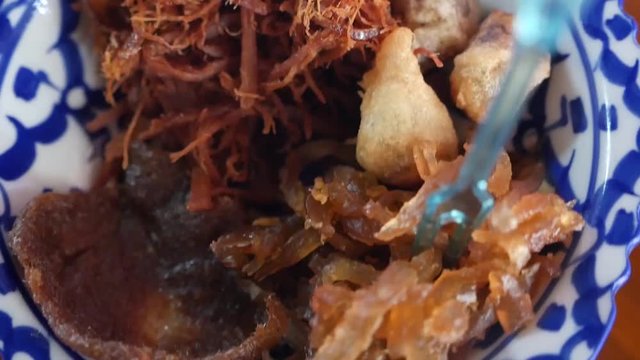 Rice In Iced Water is traditional food to eat in Songkran Festival period  made from cooked rice soaked  iced water and the side dish is Fried Shrimp Paste, Capcicum, Stuffed Onion, Salted Pork