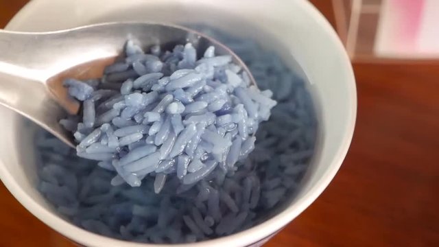 Rice In Iced Water is traditional food to eat in Songkran Festival period  made from cooked rice soaked  iced water and the side dish is Fried Shrimp Paste, Capcicum, Stuffed Onion, Salted Pork