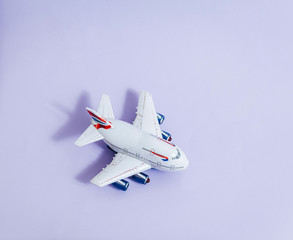 Model plane,airplane on violet color background