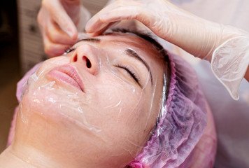 Woman in spa salon lying down and enjoy relaxing in the day spa. Different treatments at the spa