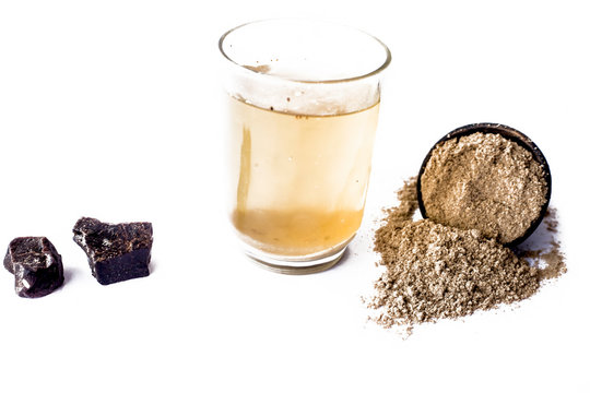 Home remedy to reduce headache or to treat headache isolated on white i.e. Hing or Devil's dung powder well mixed in water.