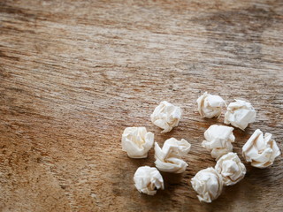 crumpled paper on wood table