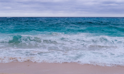 Cloudy day over the Atlantic Ocean viewed from a beach in the Bahamas.