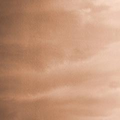 Orange with brown ink and watercolor textures on white paper background. Paint leaks and ombre effects. Hand painted abstract image.