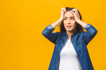 Young beautiful woman over isolated background suffering from headache desperate and stressed because pain and migraine. Hands on head. - obrazy, fototapety, plakaty