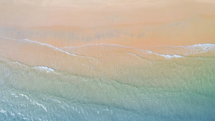 Fototapeta na wymiar Aerial view of Beach with shade emerald blue water and wave foam on tropical sea