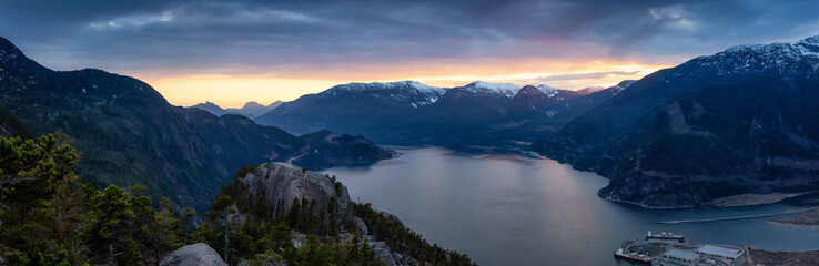 Scenic Panoramic Landscape view of the Beautiful Canadian Nature from the top of the Mountain during  a colorful sunset. Taken in Squamish, North of Vancouver, BC, Canada.
