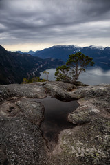 Scenic Landscape view from the top of the Mountain during  a cloudy day. Taken in Squamish, North of Vancouver, BC, Canada.