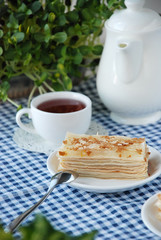 cup of coffee and cake on wooden table