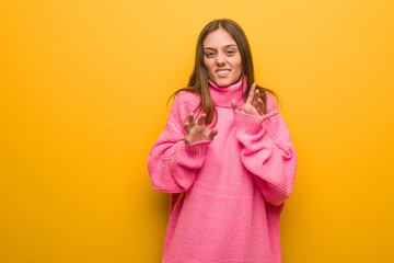 Young modern woman rejecting something doing a gesture of disgust