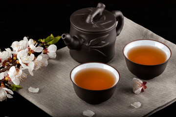 Chinese brown teapot and cups for tea