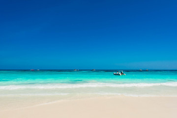 Fototapeta na wymiar Beautiful blue ocean with gentle wave in summer for relaxation, Wonderful tropical beach