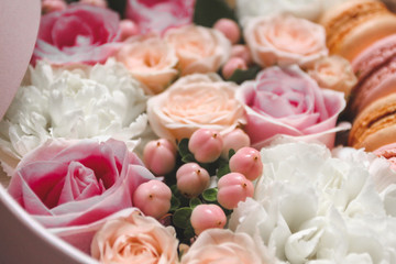 Beautiful floral background in the Box with the macaroons on top of the background