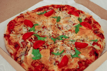 Pizza in a cardboard box . Space for text. View from above. Pizza delivery.