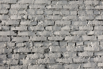 Old brick wall pattern of white color of modern design style decorative uneven. Close-up.