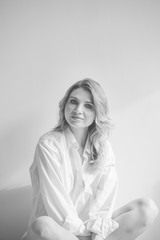 Fototapeta premium portrait of a beautiful blonde woman on a white background black and white photo