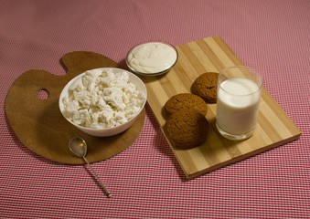 healthy breakfast with cottage cheese, milk, oatmeal cookies
