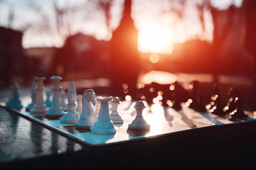 chess board on street or park in lights on sun