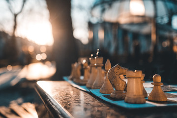 chess board on street or park in lights on sun