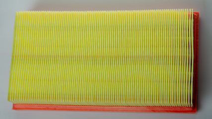 clean car air filter, on a white background close up, expendable