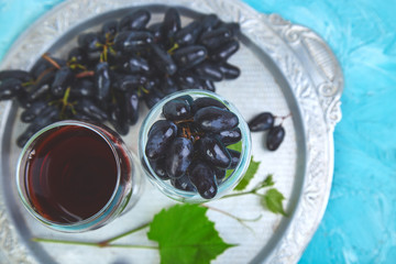 Red wine concept with bottle, glass and grapes