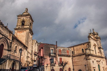 Vizzini, Sicily, Italy: HDR main historic church square of Vizzini, the beauty of its characteristic baroque architecture with cloudy sky in background