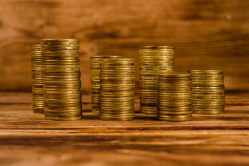 Stacks of the coins on wooden table