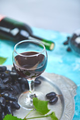 Red wine concept with bottle, glass and grapes