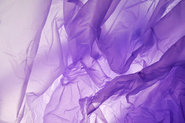 Plastic bag. Interesting two layer lilac and violet horizontal gradient background.The middle is lighter than other sides of image.