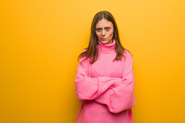 Young modern woman crossing arms relaxed