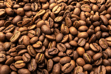 Roasted coffee beans, can be used as a background. Coffee beans background. Top view. Copy space
