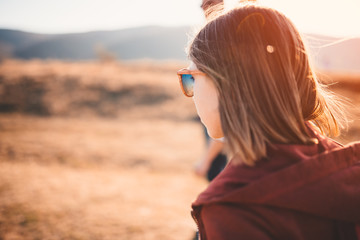 Teenage girl walking on a mountain road