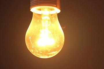 incandescent yellow glow. old lighting format, large power consumption. very warm. lamp in the...