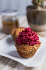 Strawberry cupcake on a wooden table