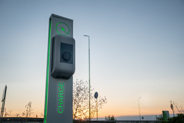 electric vehicle charger on clear sky background