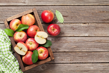Red apples in wooden box