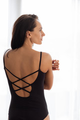 Portrait of a beautiful dark-haired girl in a black training suit