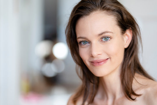 Portrait of smiling woman with brown hair