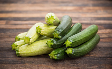 Fresh organic zucchini on the wooden table