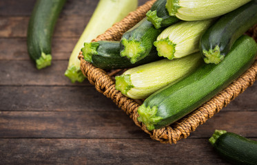 Fresh organic zucchini on the wooden table