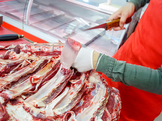 Butcher Cutting rib meat