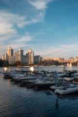 Fototapeta na wymiar yacht club with boats on city skyline