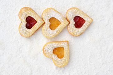  Homemade linzer cookies filled with strawberry and apricot jam